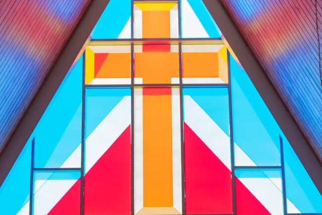 colorful geometrical stained glass window with rood