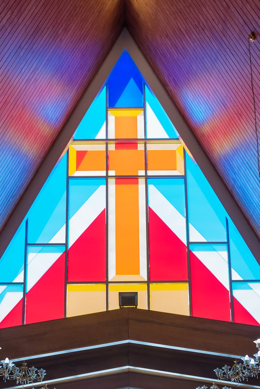 colorful geometrical stained glass window with rood