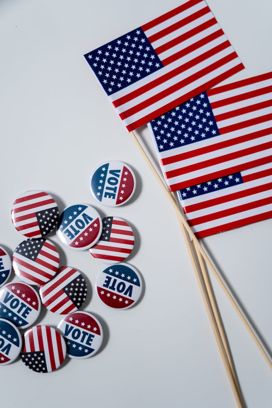 american flags and pins on white background