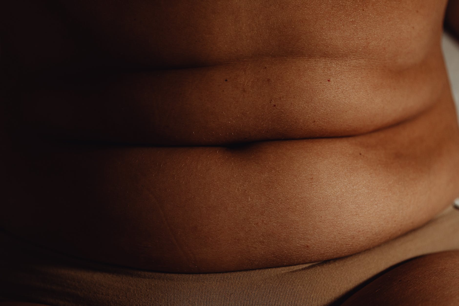 a person s belly with folds
